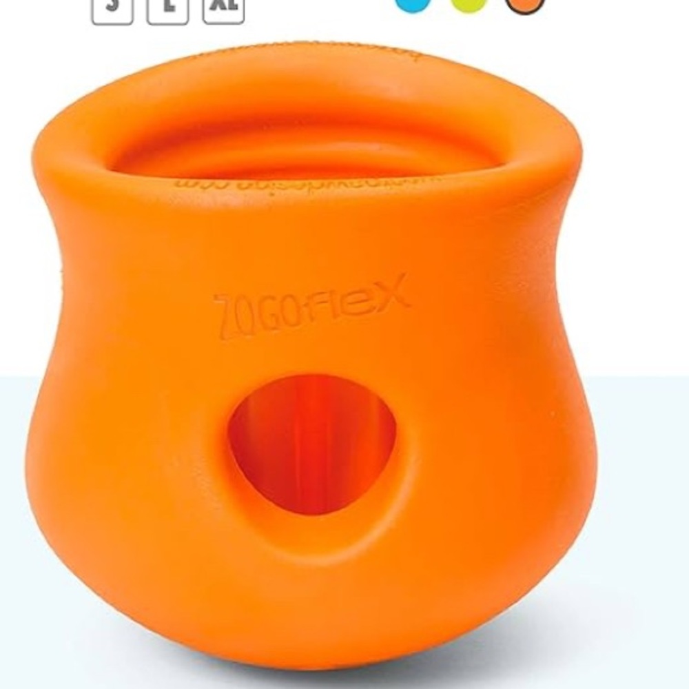 NINE Toppl Dog Treat dispensing dog toys.